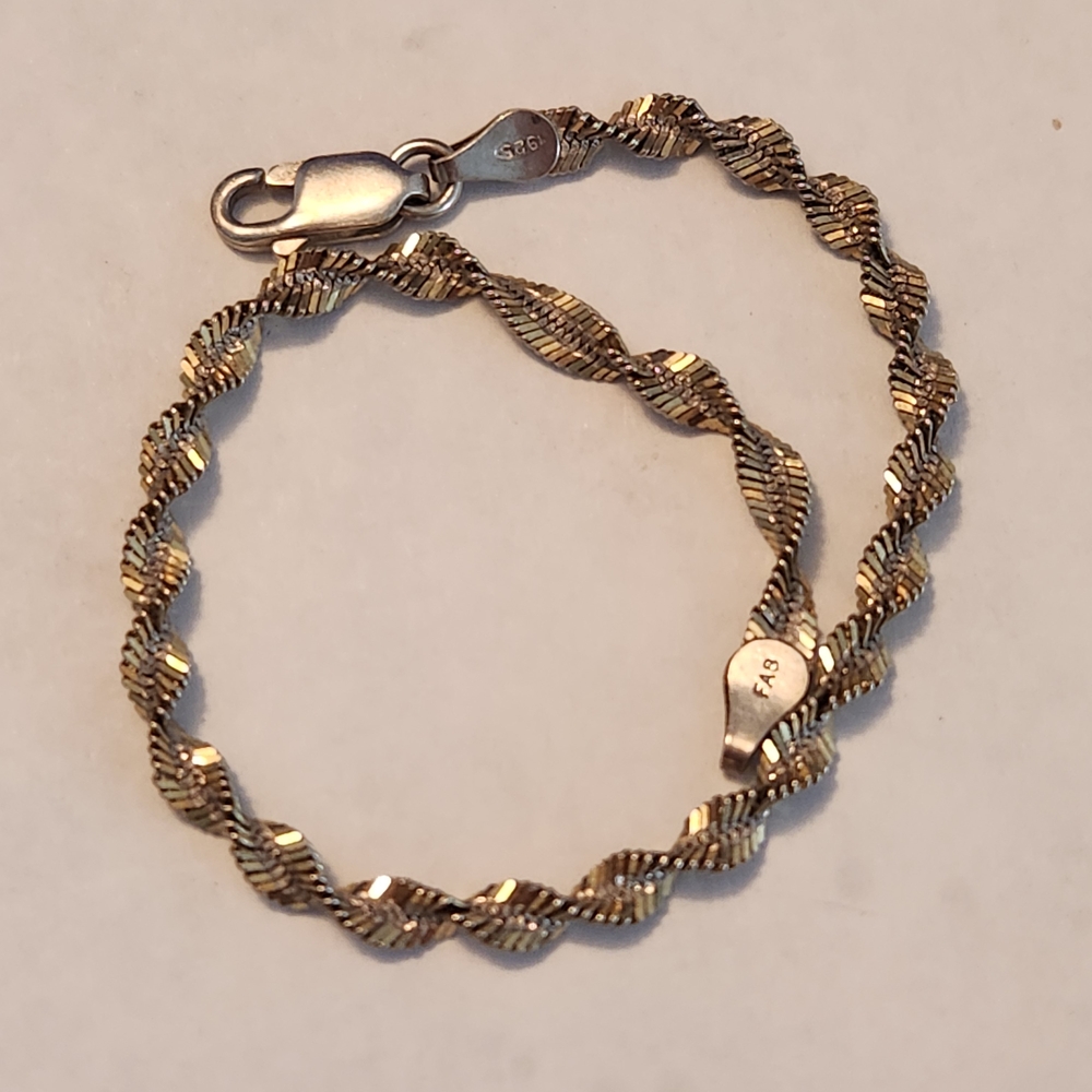 Elegant Gold and Silver Twist Bracelet
